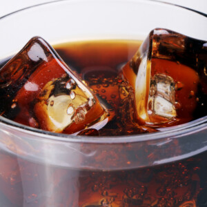 Fresh and cold cola drink in glass